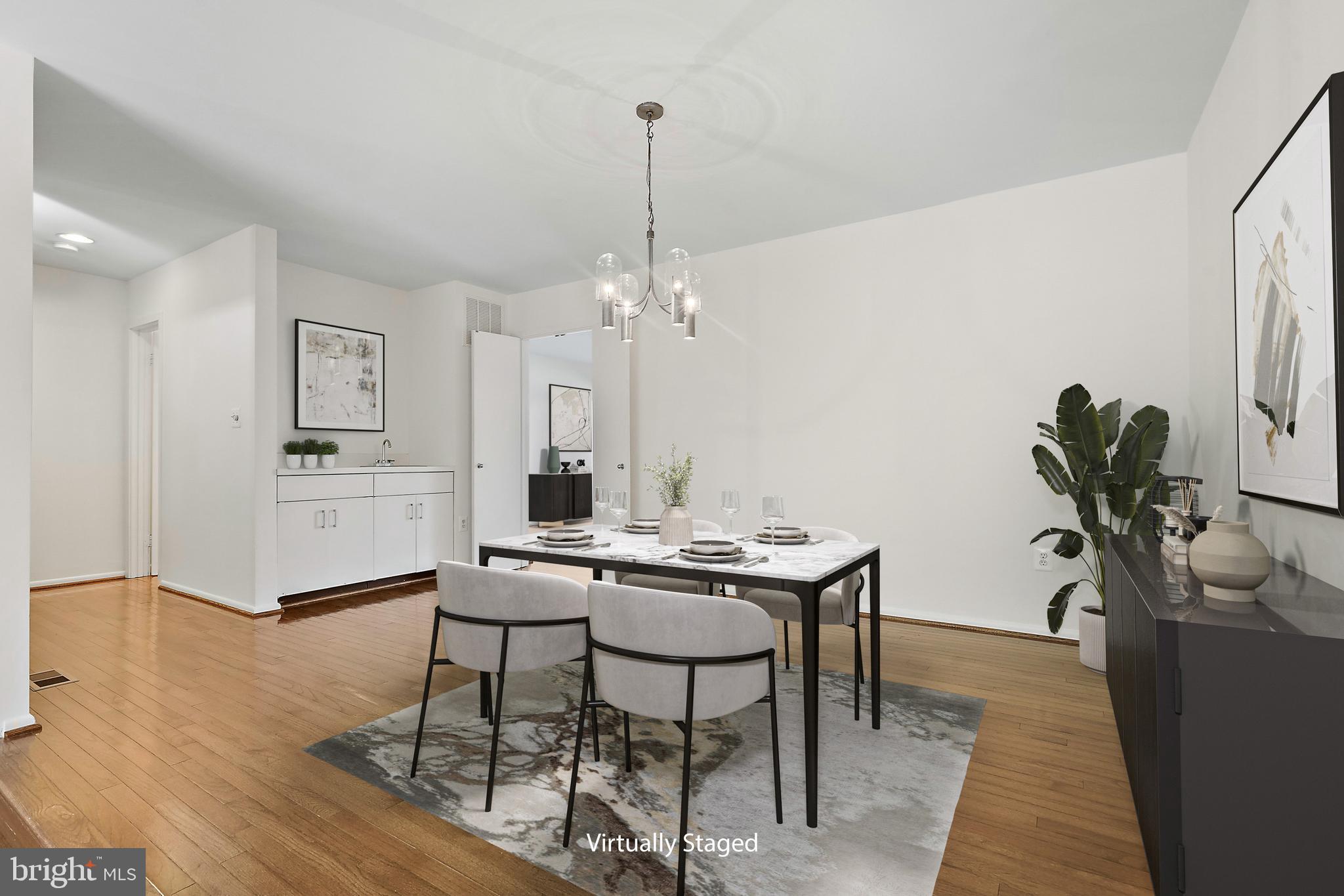 2006 Lakebreeze Way Reston, VA 20191 - Photo 16 of 49 a view of a dining room with furniture and a potted plant