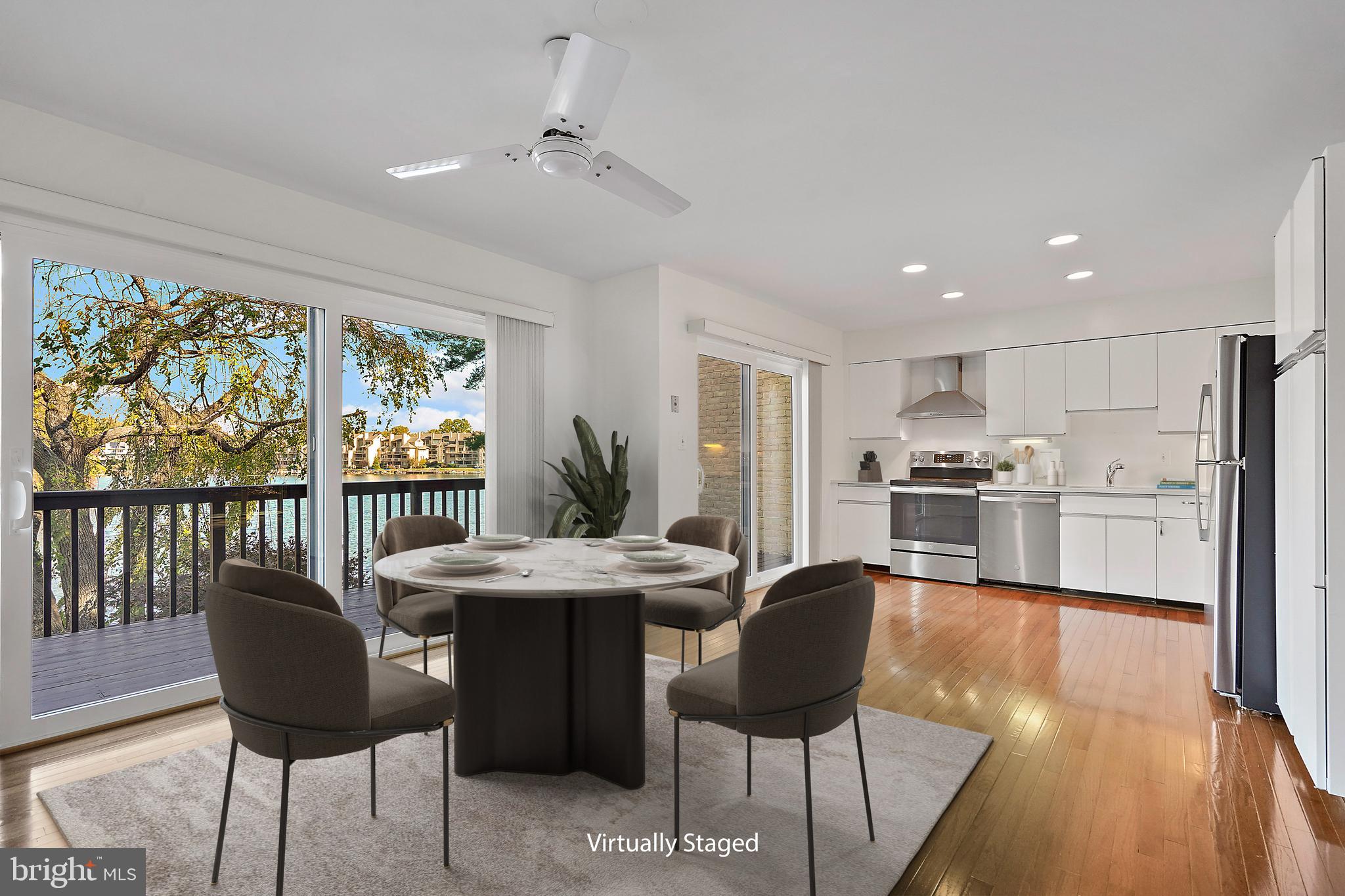 2006 Lakebreeze Way Reston, VA 20191 - Photo 18 of 49 a view of a dining room with furniture window and outside view