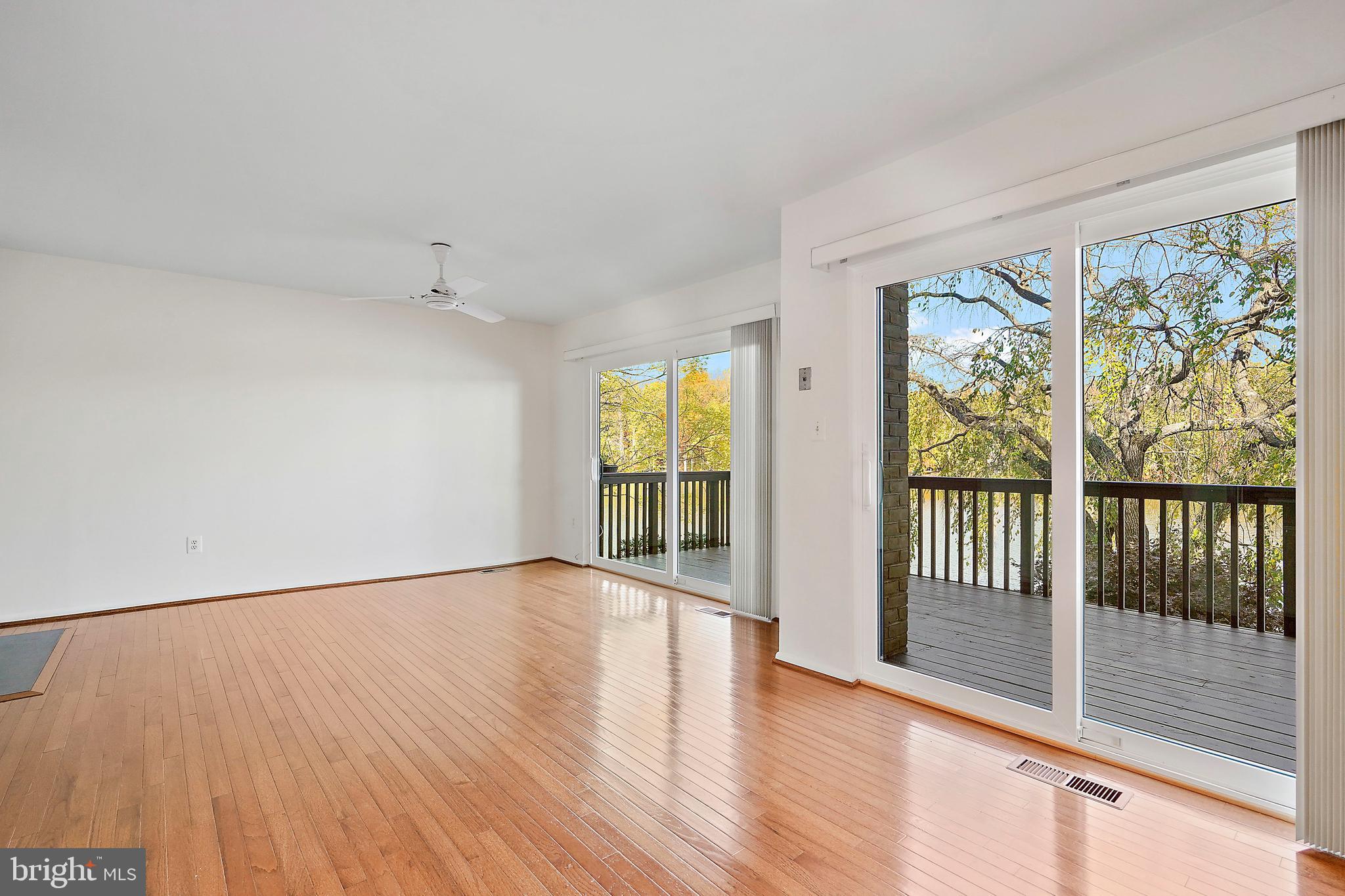 2006 Lakebreeze Way Reston, VA 20191 - Photo 22 of 49 wooden floor in an empty room with a window