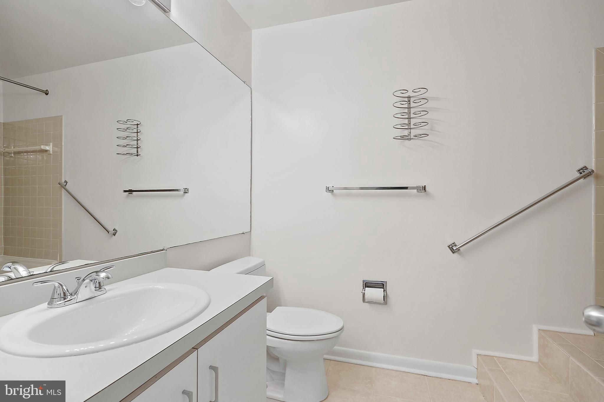 2006 Lakebreeze Way Reston, VA 20191 - Photo 27 of 49 a bathroom with a sink a toilet and mirror