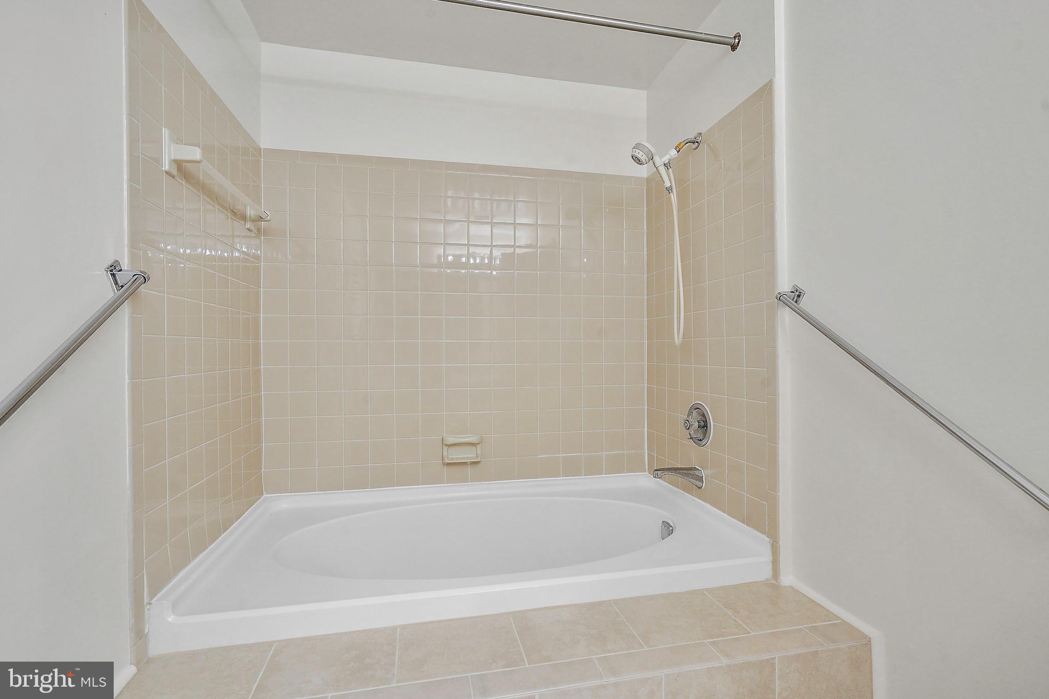2006 Lakebreeze Way Reston, VA 20191 - Photo 28 of 49 a bathroom with a shower and a bath tub