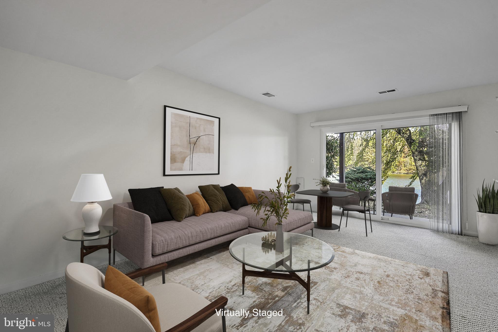 2006 Lakebreeze Way Reston, VA 20191 - Photo 38 of 49 a living room with furniture and a large window