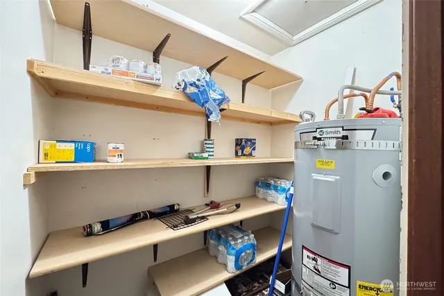 a room with a refrigerator and a sink