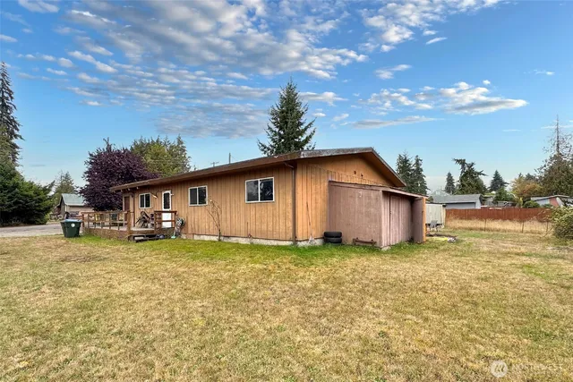 a big house with a big yard and large trees