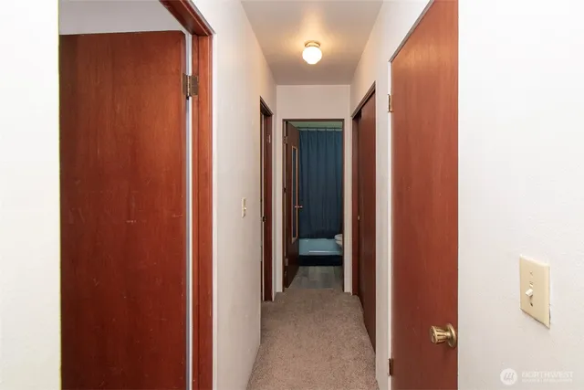 a view of a hallway with closet