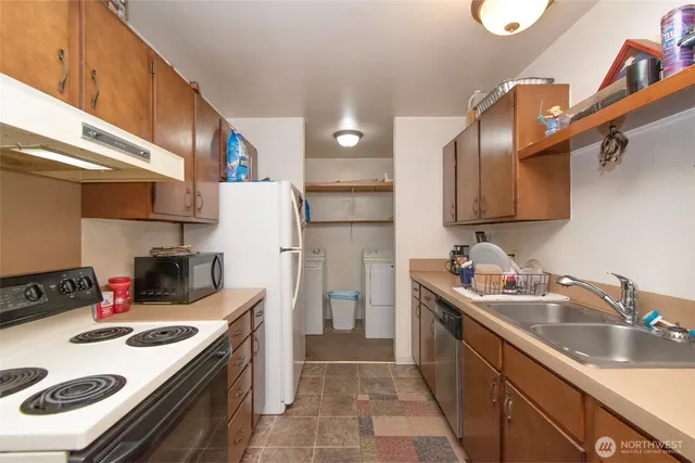 a kitchen that has a sink and a stove