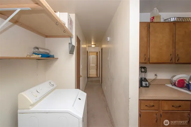 a view of storage and utility room with washer and dryer