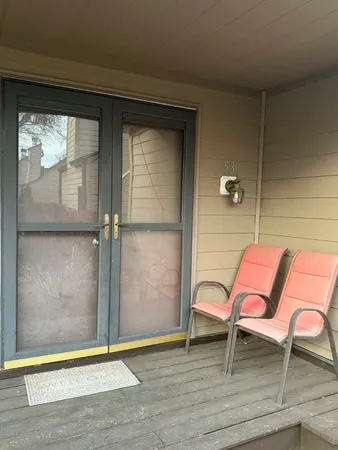 a bench sitting in front of a window