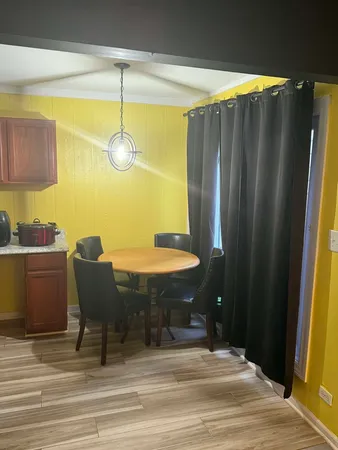 a kitchen with a refrigerator and a stove