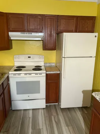 a bathroom with a toilet sink and shower