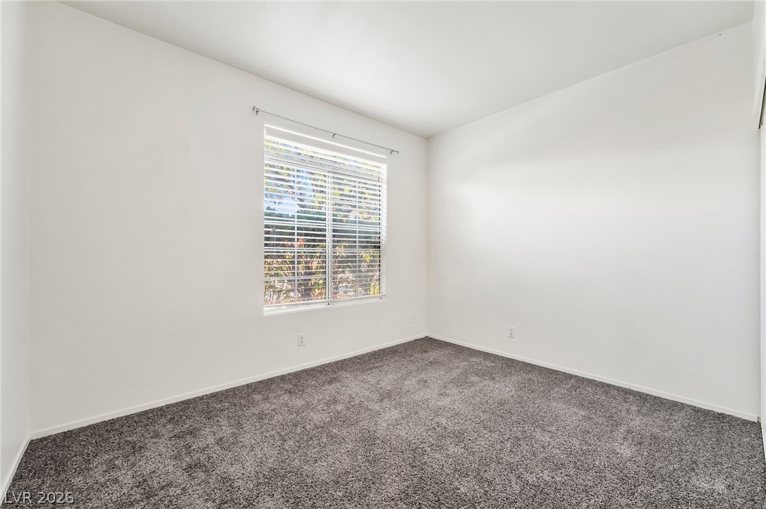 2201 Ramsgate Drive, Unit 811 Henderson, NV 89074 - Photo 24 of 36 A well-lit bedroom offering a serene space with ample natural light.