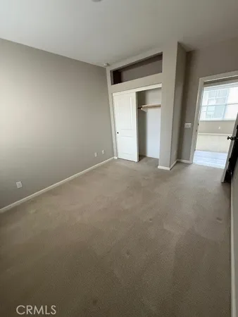 a view of empty room with windows
