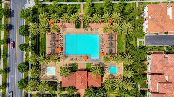 an aerial view of a house with a yard and garden