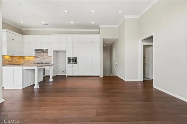 a view of kitchen with wooden floor