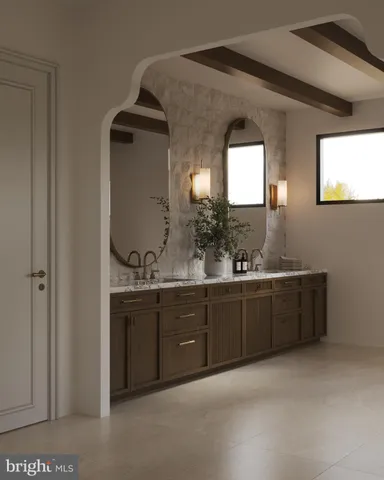 a large kitchen with kitchen island a large island in it