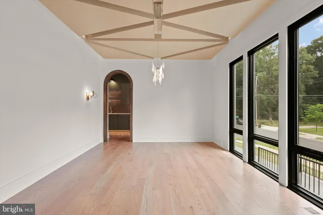 a view of an empty room with glass door