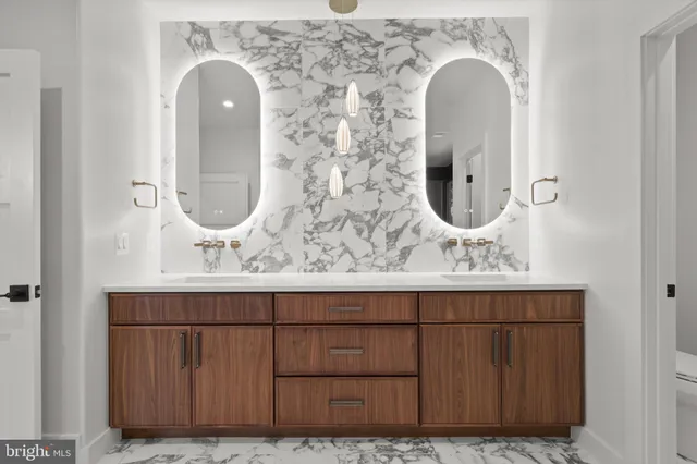 a view of kitchen with refrigerator and window