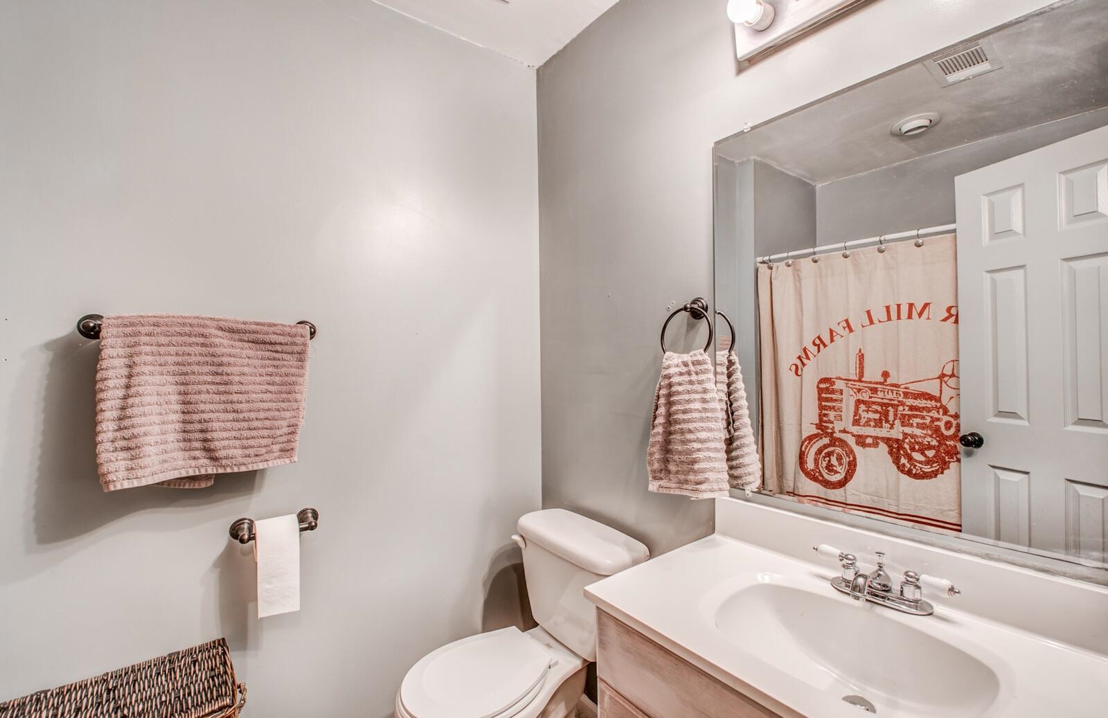 9970 Idaville Road Atoka, TN 38004 - Photo 13 of 25 a bathroom with a toilet sink and mirror