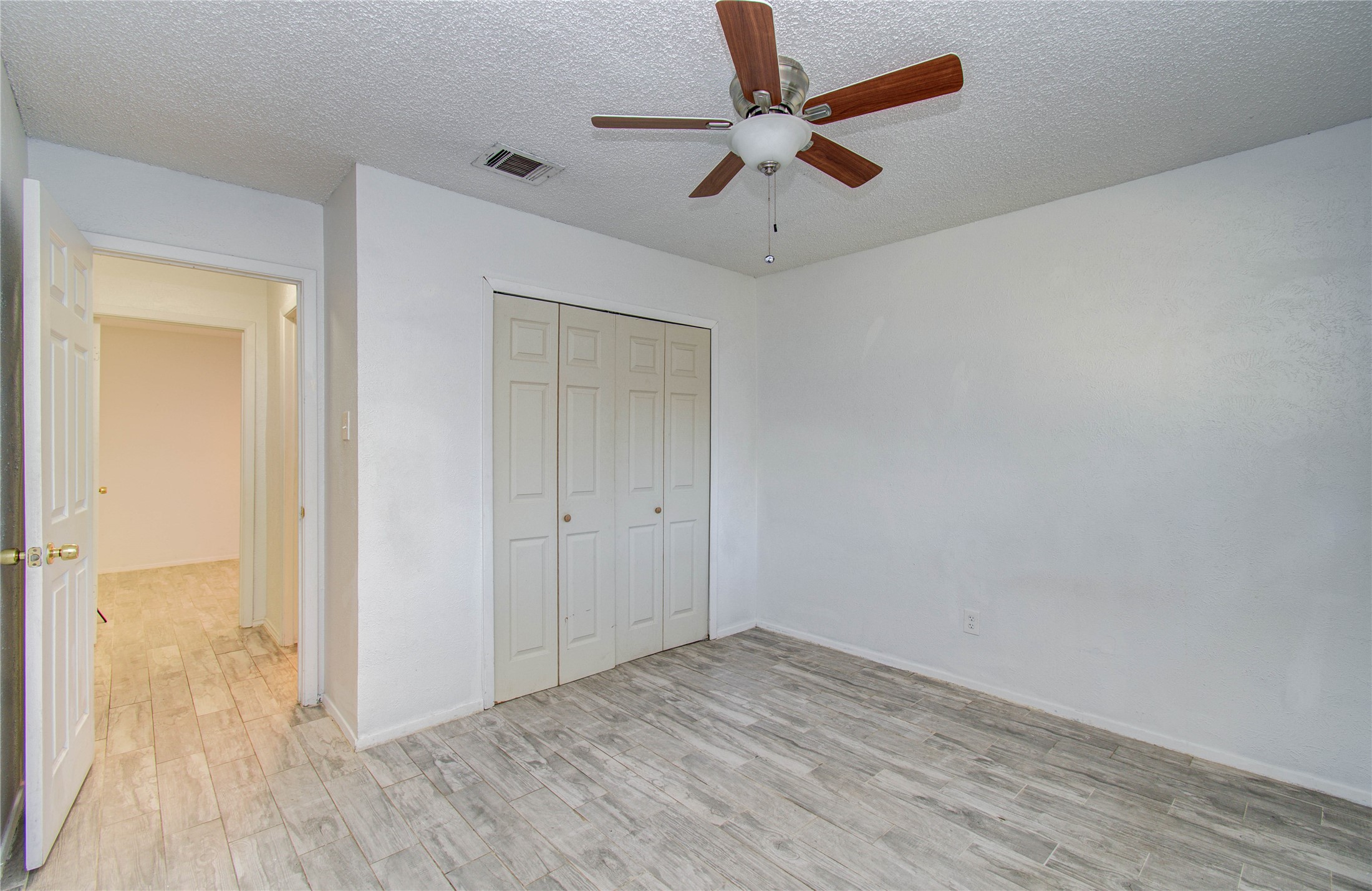5311 Sweetwind Lane Spring, TX 77373 - Photo 13 of 18 wooden floor in an empty room
