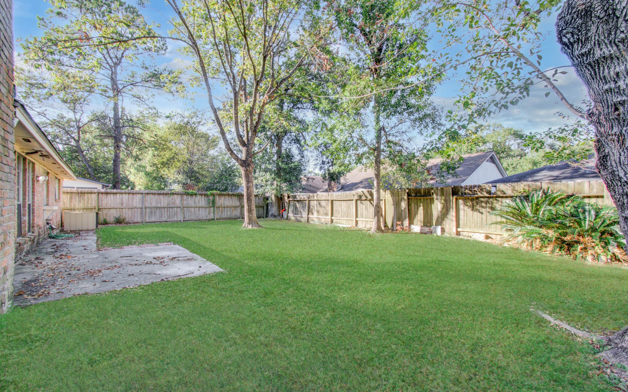 5311 Sweetwind Lane Spring, TX 77373 - Photo 17 of 18 a view of yard with a big yard and large trees