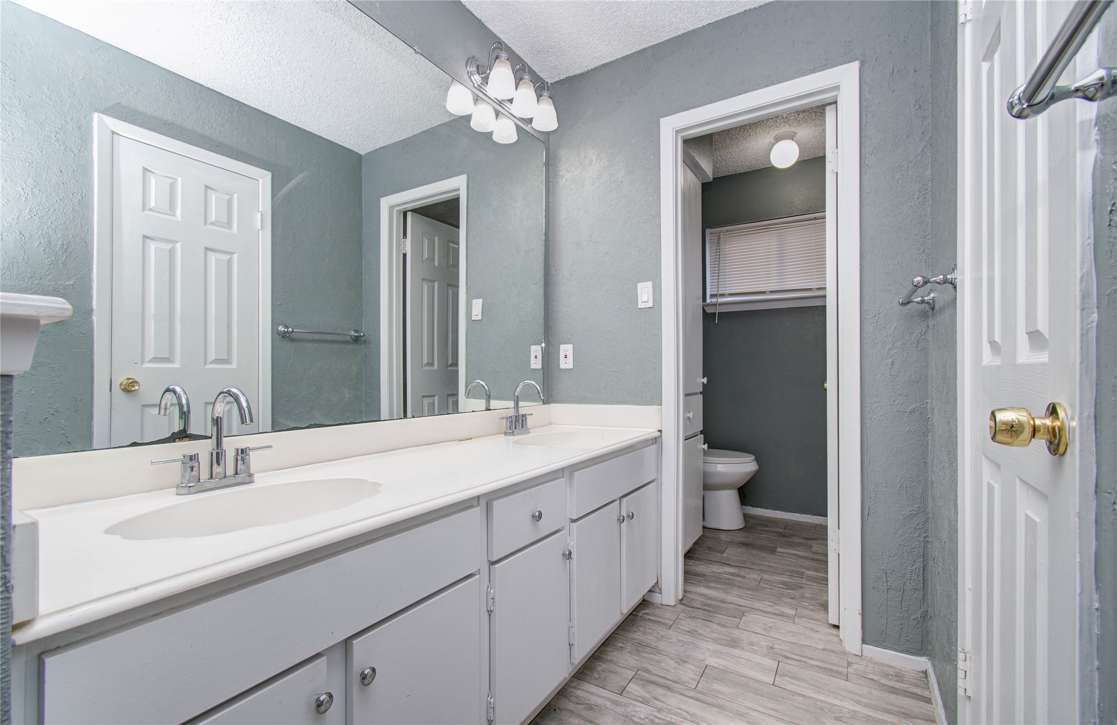 5311 Sweetwind Lane Spring, TX 77373 - Photo 9 of 18 a bathroom with a double vanity sink and a mirror