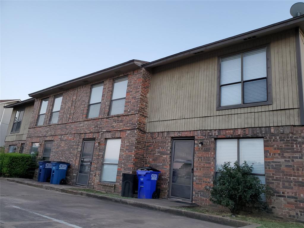 724 Bluebonnet Drive, Unit A Keller, TX 76248 - Photo 25 of 27 a tall building with a small yard