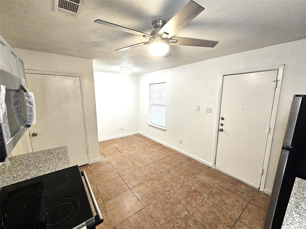 724 Bluebonnet Drive, Unit A Keller, TX 76248 - Photo 9 of 27 a view of a livingroom with a dishwasher cabinets and wooden floor