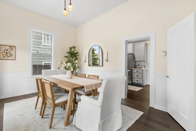 a view of a dining room with furniture and window