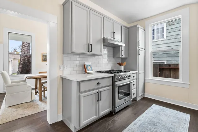 a kitchen with stainless steel appliances granite countertop a stove and a refrigerator
