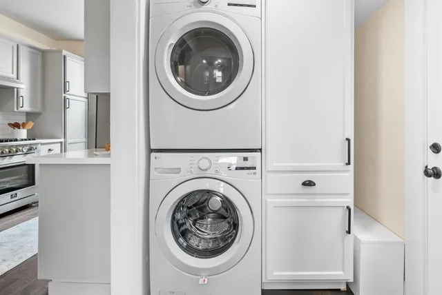 a view of a hallway with washer and dryer