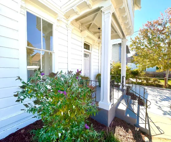 a view of a house with a flower garden