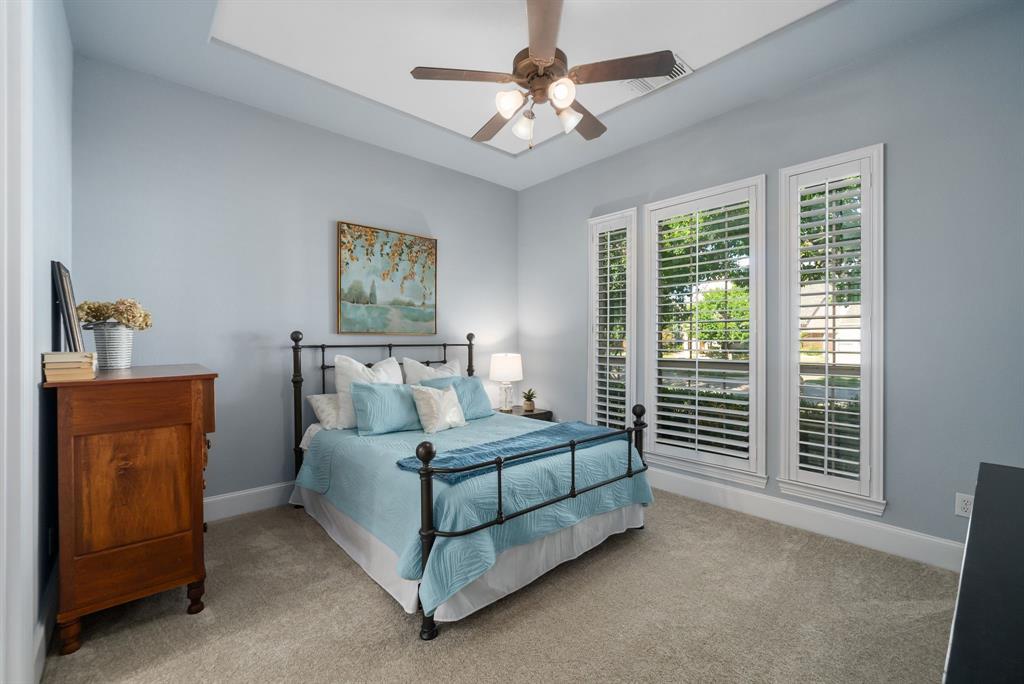 11571 Cody Lane Frisco, TX 75033 - Photo 16 of 39 a bedroom with a bed and a window