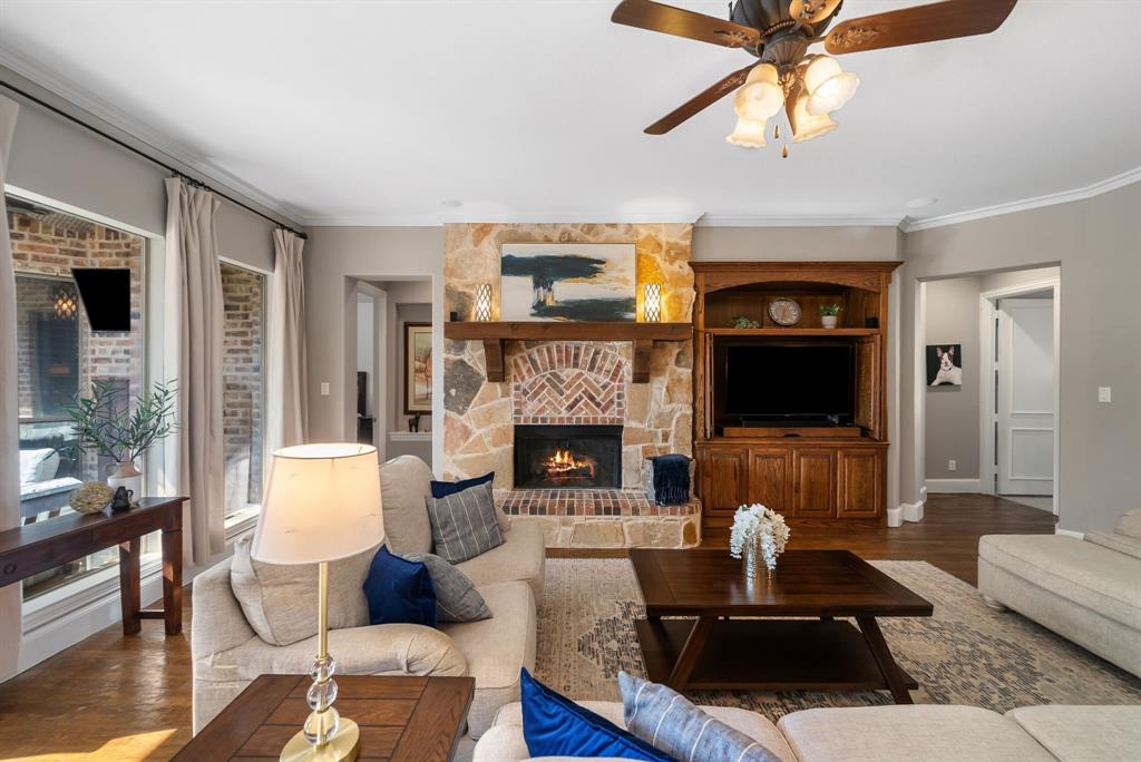 11571 Cody Lane Frisco, TX 75033 - Photo 9 of 39 a living room with furniture and a fireplace