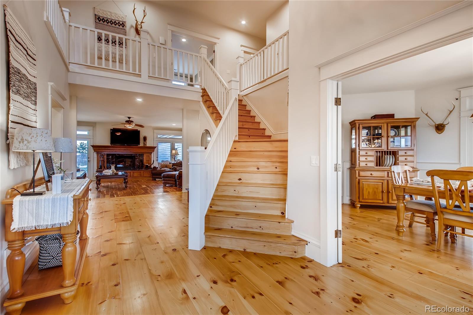 727 East Rim Road Franktown, CO 80116 - Photo 13 of 40 a view of entryway and hall with wooden floor
