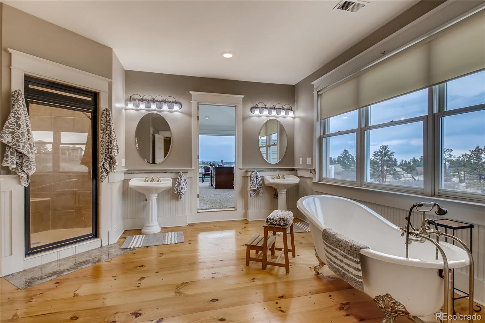 727 East Rim Road Franktown, CO 80116 - Photo 19 of 40 a living room with fireplace furniture and a large window