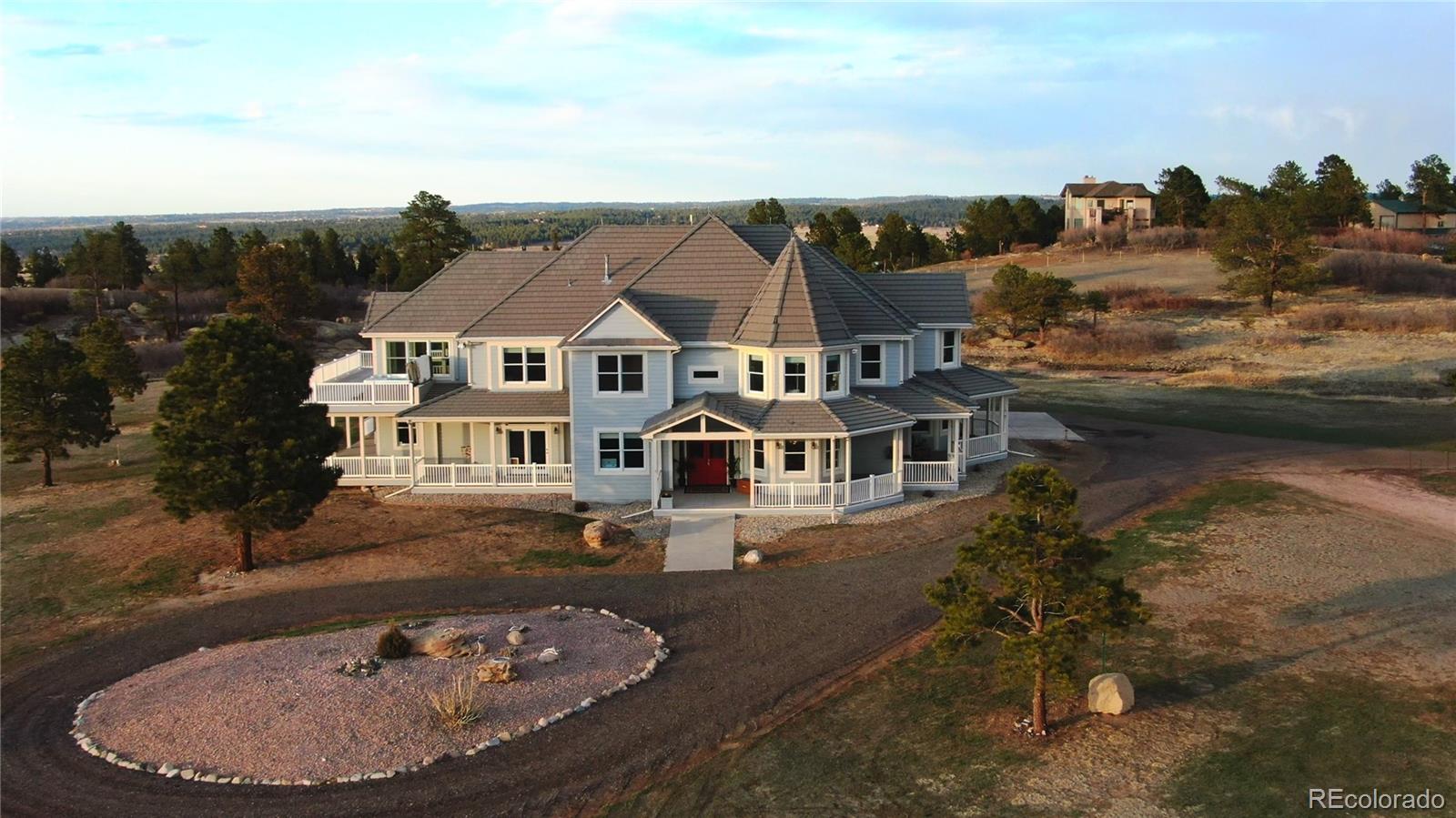 727 East Rim Road Franktown, CO 80116 - Photo 3 of 40 an aerial view of a house