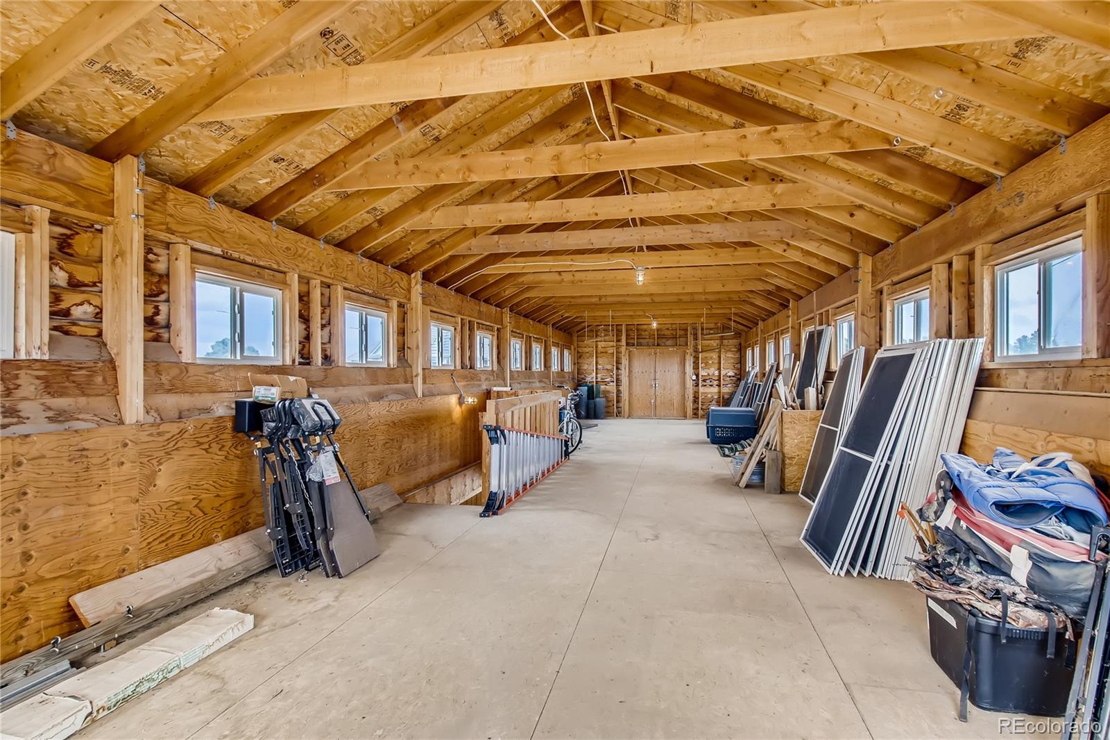 727 East Rim Road Franktown, CO 80116 - Photo 36 of 40 a view of a garage with furniture