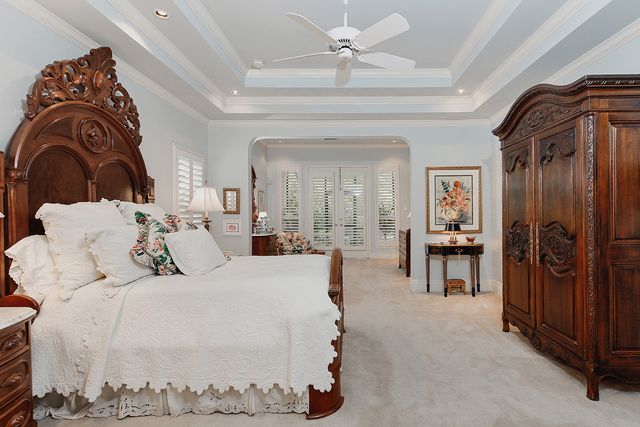 a bedroom with two beds and painting on the wall