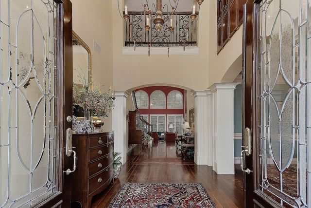 a view of a dining room with furniture and chandelier