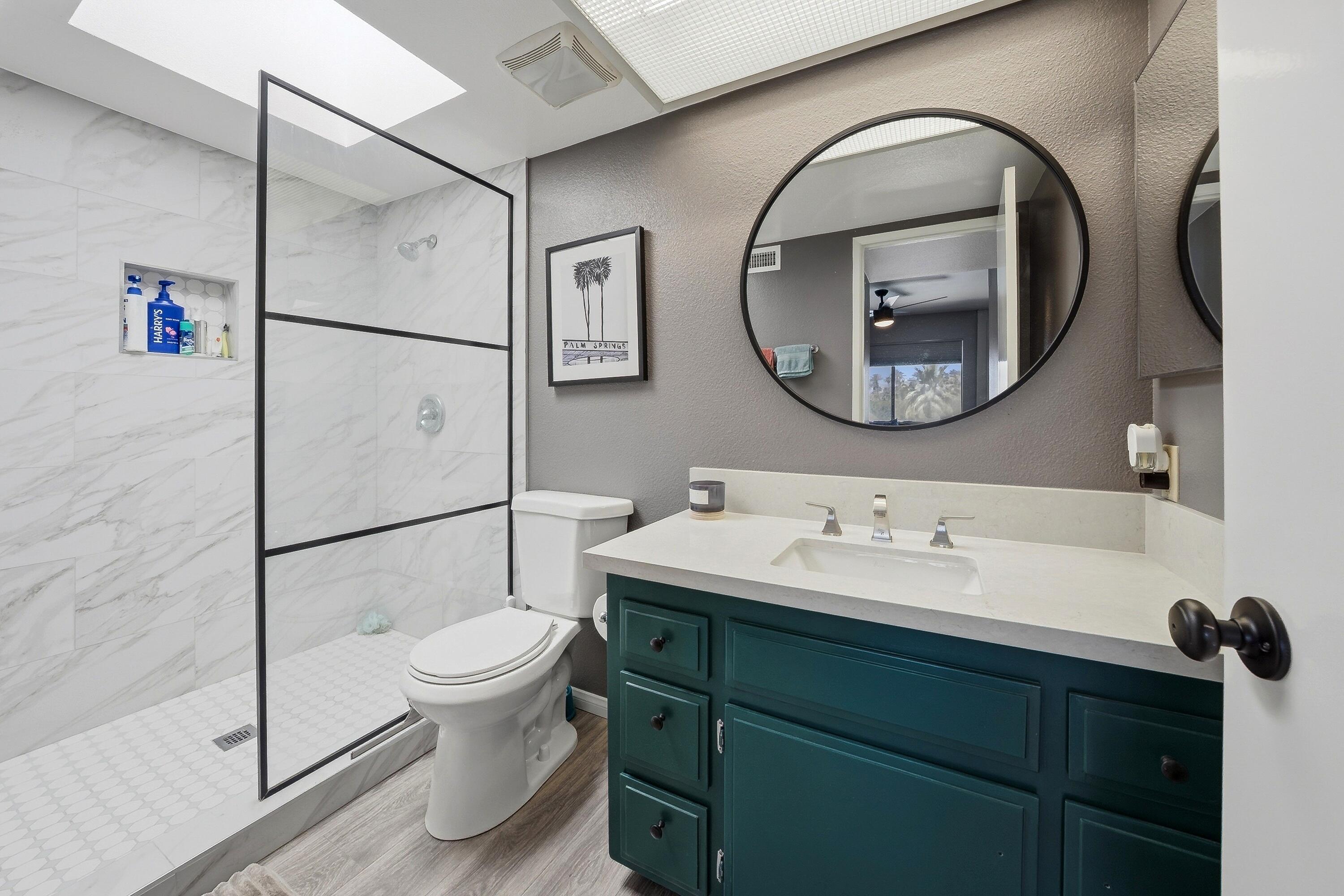 71870 Eleanora Lane Rancho Mirage, CA 92270 - Photo 18 of 36 a bathroom with a toilet a sink and a mirror