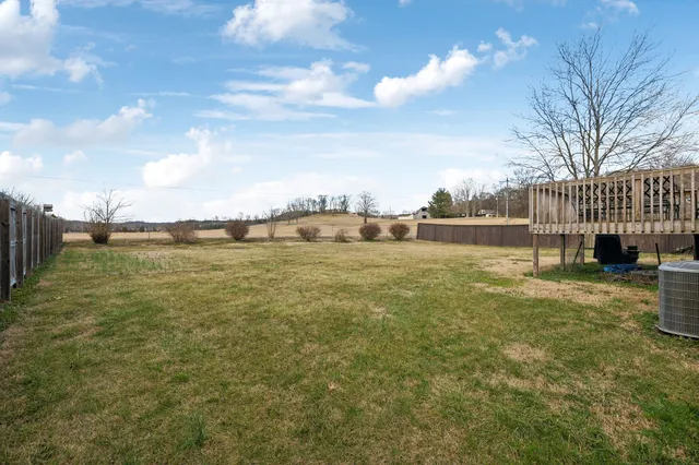 a view of a patio with a yard