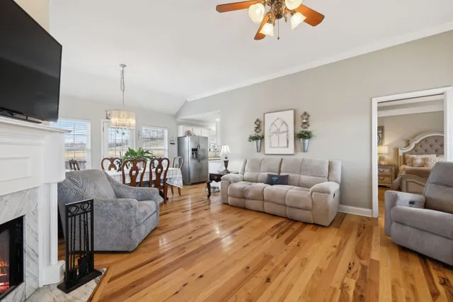 a living room with furniture and a flat screen tv