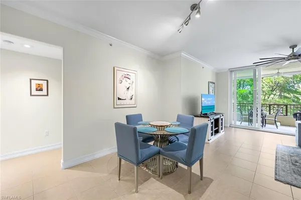 a view of a dining room with furniture window and outside view