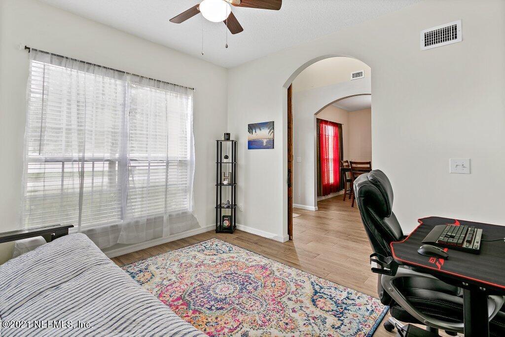 621 East Red House Branch Road St. Augustine, FL 32084 - Photo 8 of 47 a bedroom with furniture and a window