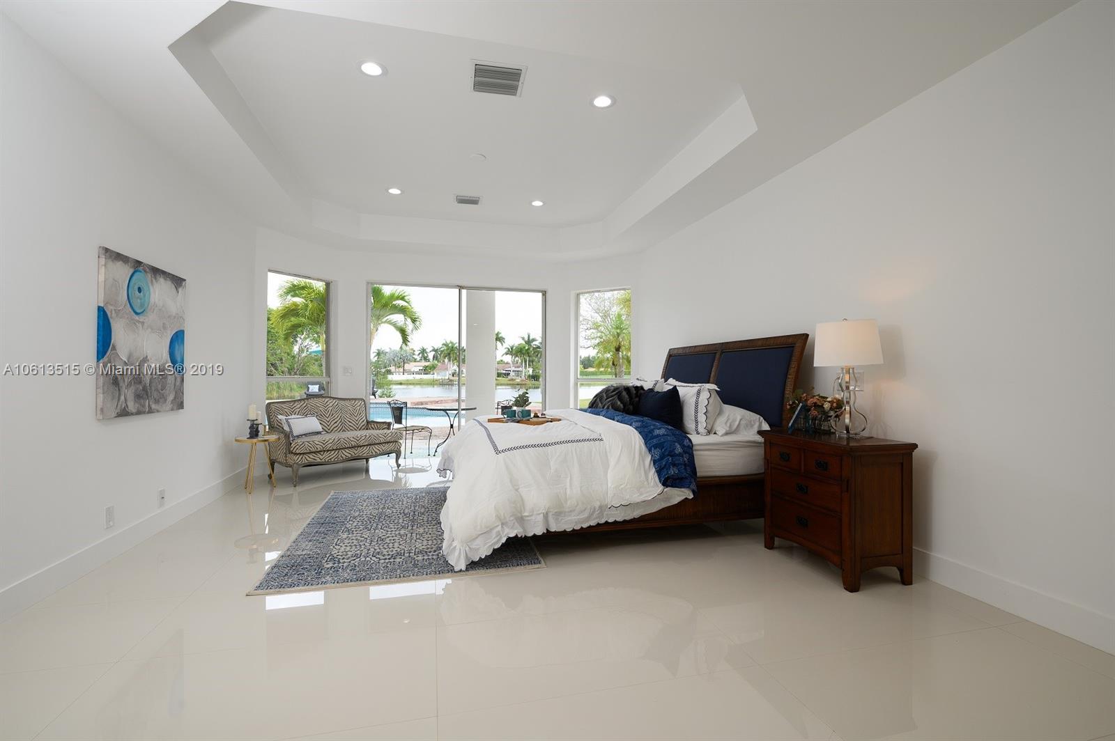 561 Ranch Road Weston, FL 33326 - Photo 14 of 46 a bed room with bed and window