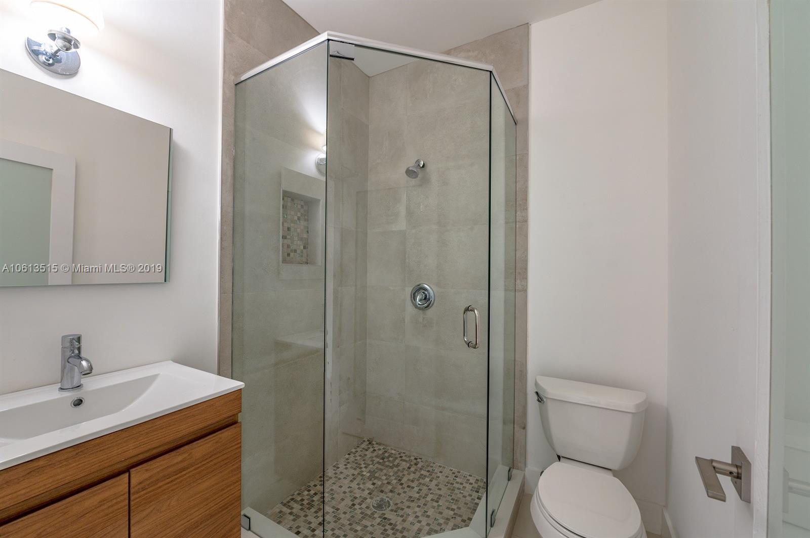 561 Ranch Road Weston, FL 33326 - Photo 24 of 46 a bathroom with a granite countertop sink toilet and shower