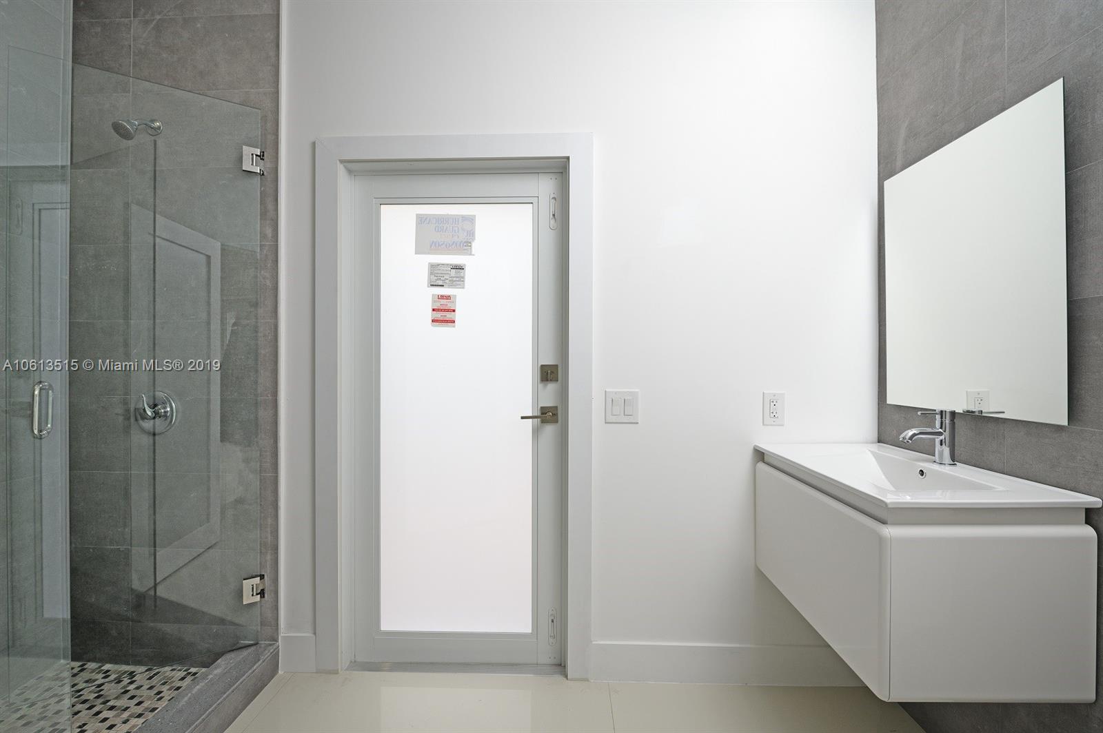 561 Ranch Road Weston, FL 33326 - Photo 27 of 46 a bathroom with a bathtub and a sink