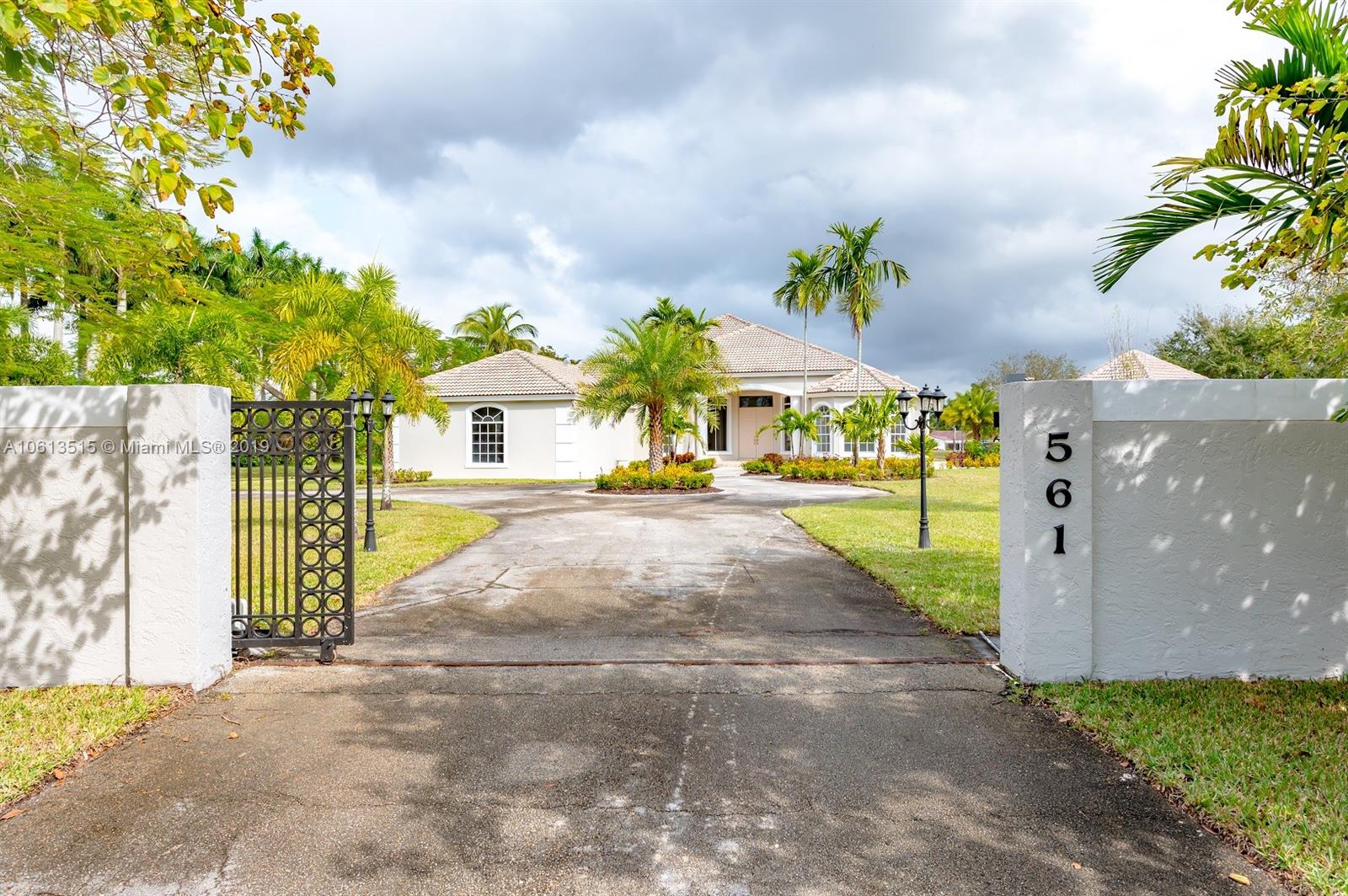 561 Ranch Road Weston, FL 33326 - Photo 28 of 46 a view of a garden with a building