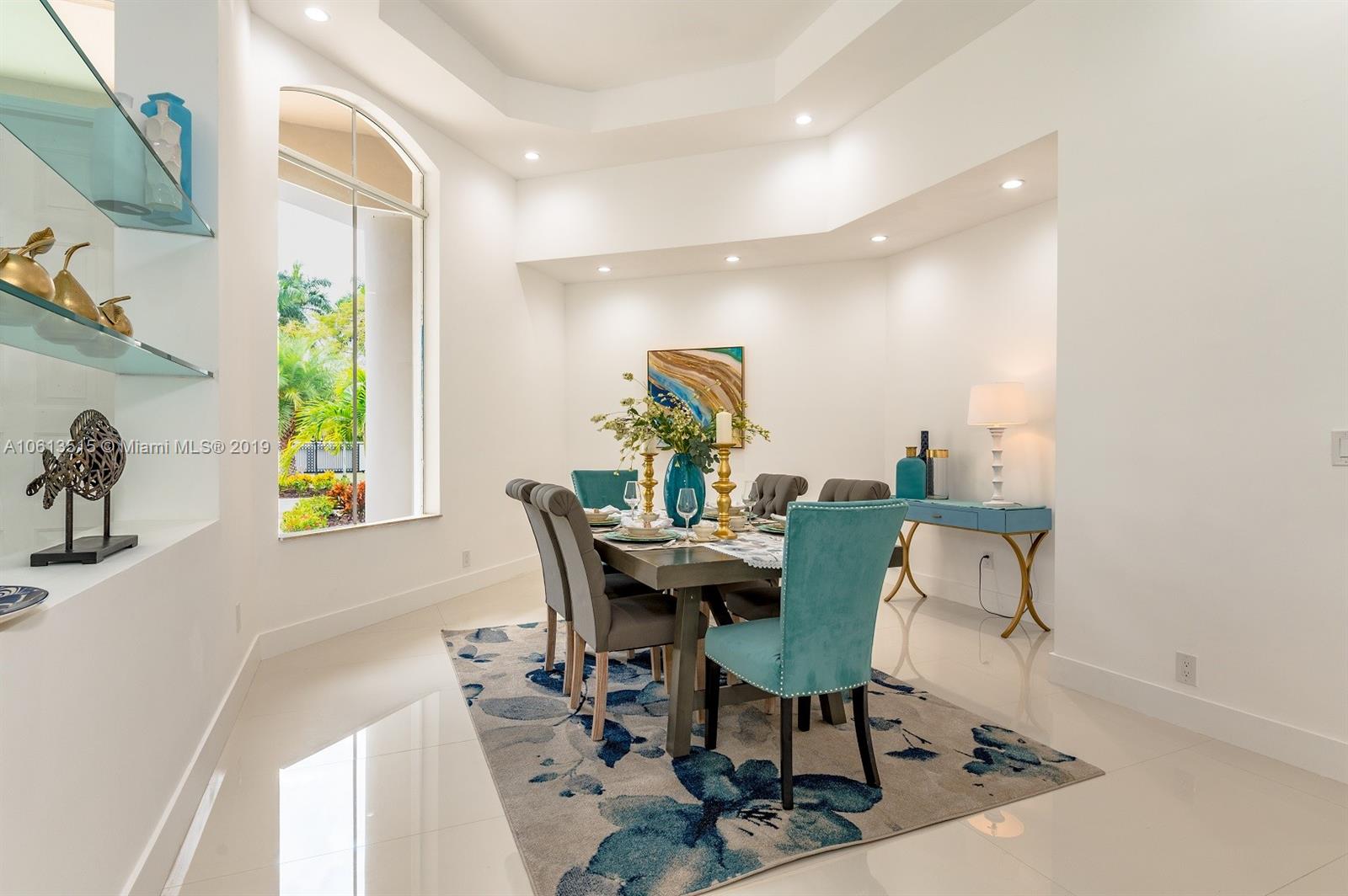 561 Ranch Road Weston, FL 33326 - Photo 3 of 46 a view of a dining room with furniture and a window