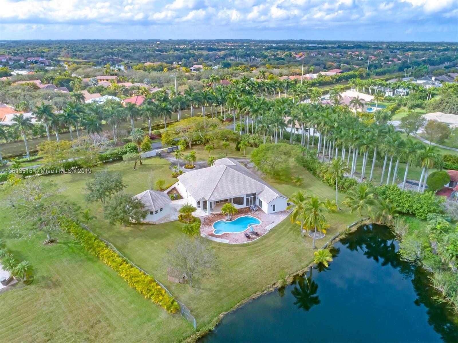 561 Ranch Road Weston, FL 33326 - Photo 34 of 46 an aerial view of residential houses with outdoor space and trees